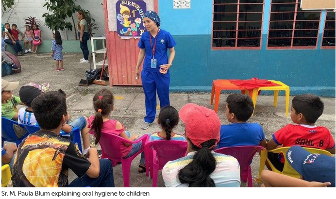 One Young Nun Serves God with a Dental Drill and a Smartphone